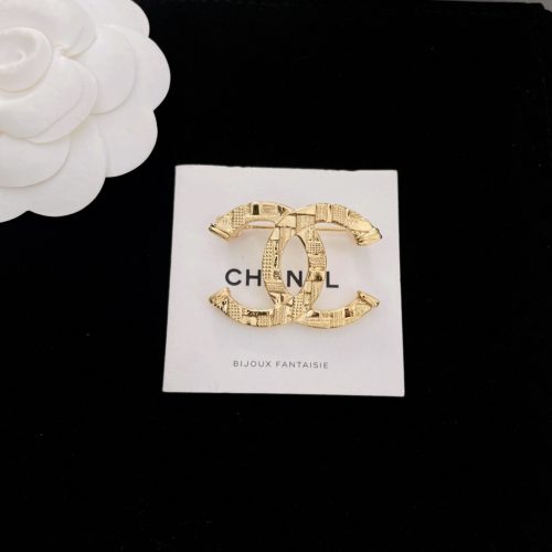 Ch brooch